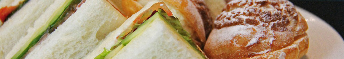 Eating Deli Sandwich at Sandwich Board restaurant in Alameda, CA.